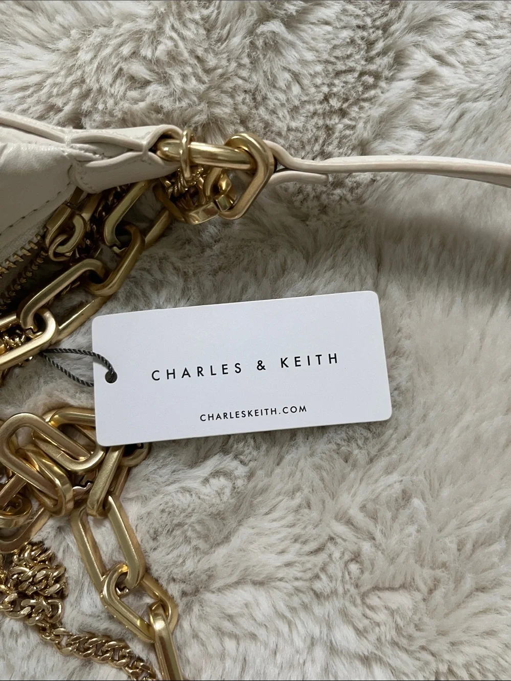 Charles & Keith Cream Quilted Crescent Bag with Gold Chains